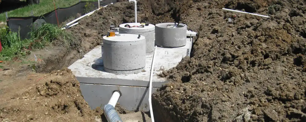 Septic system repair and installation site with tank access ports in Colorado Springs, CO